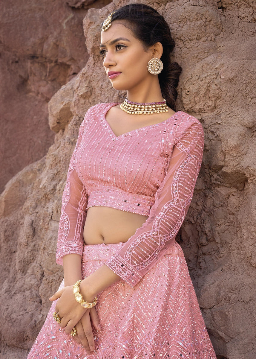 Creamy Pink Net Lehenga Choli Adorned With Cutwork, Mirror, And Zarkan Embellishments - House of Sarvati LLC