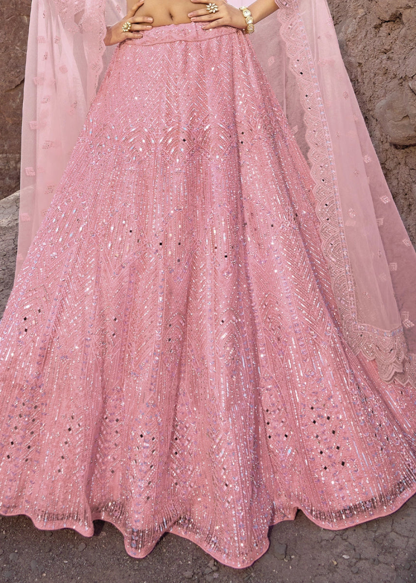 Creamy Pink Net Lehenga Choli Adorned With Cutwork, Mirror, And Zarkan Embellishments - House of Sarvati LLC