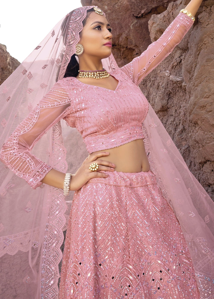 Creamy Pink Net Lehenga Choli Adorned With Cutwork, Mirror, And Zarkan Embellishments - House of Sarvati LLC