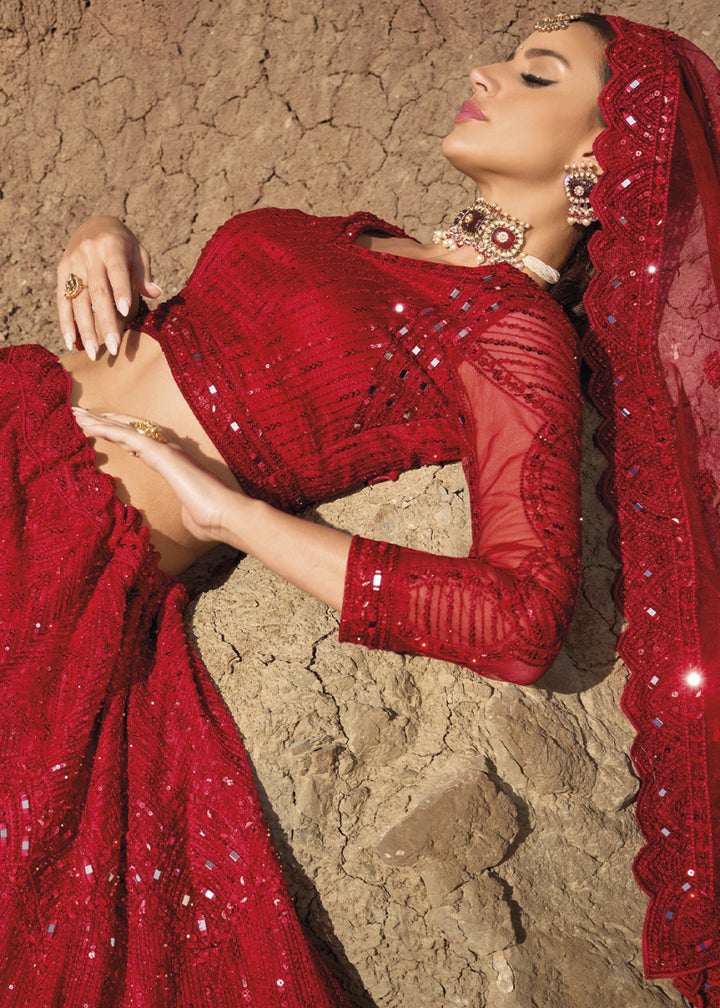 Crimson Red Net Lehenga Choli Adorned With Cutwork, Mirror, And Zarkan Embellishments - House of Sarvati LLC