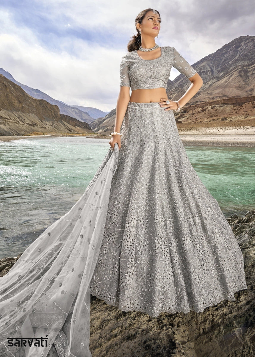 Dove Grey Organza Lehenga Choli Adorned With Cutwork, Mirror, And Zarkan Embellishments - House of Sarvati LLC