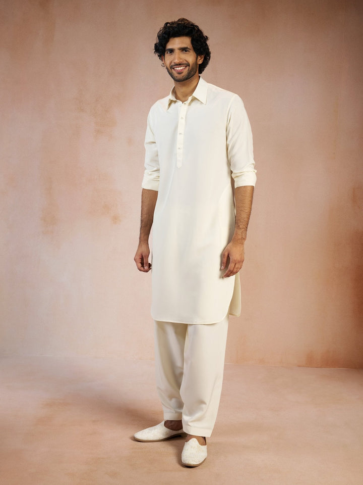 https://cdn.shopify.com/s/files/1/1147/1390/files/mens-cream-solid-silk-blend-pathani-kurta-with-patiala-pyjama-setvasmpt1045crnp-36vastramay-2542119.jpg?v=1773990379