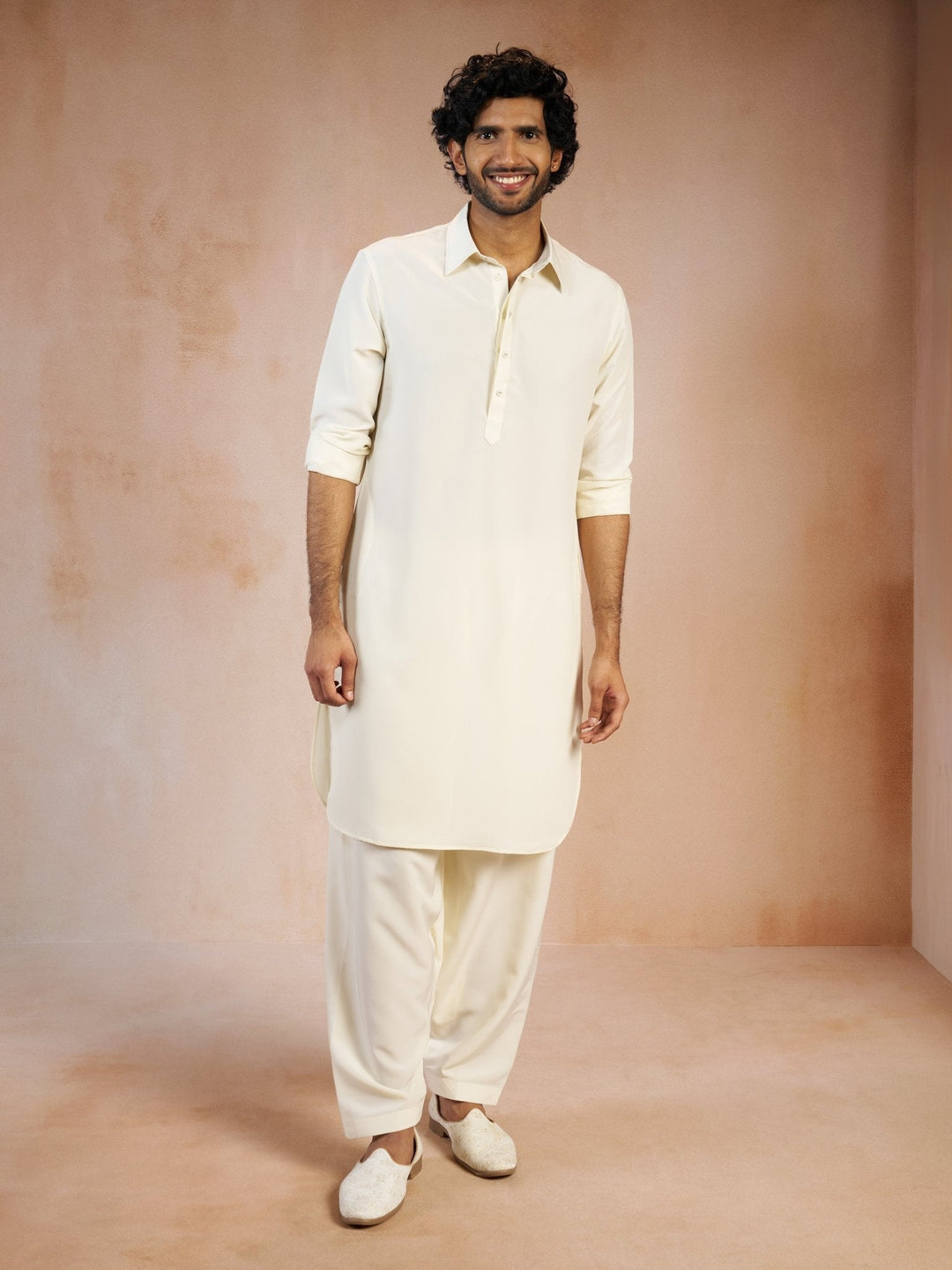 https://cdn.shopify.com/s/files/1/1147/1390/files/mens-cream-solid-silk-blend-pathani-kurta-with-patiala-pyjama-setvasmpt1045crnp-36vastramay-5896194.jpg?v=1773990380