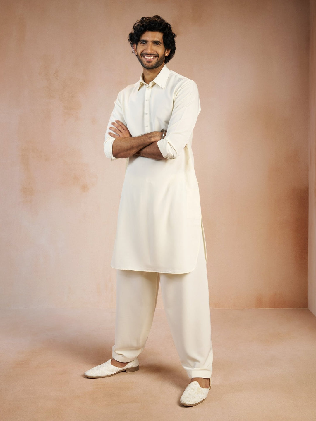 https://cdn.shopify.com/s/files/1/1147/1390/files/mens-cream-solid-silk-blend-pathani-kurta-with-patiala-pyjama-setvasmpt1045crnp-36vastramay-7239314.jpg?v=1773990380