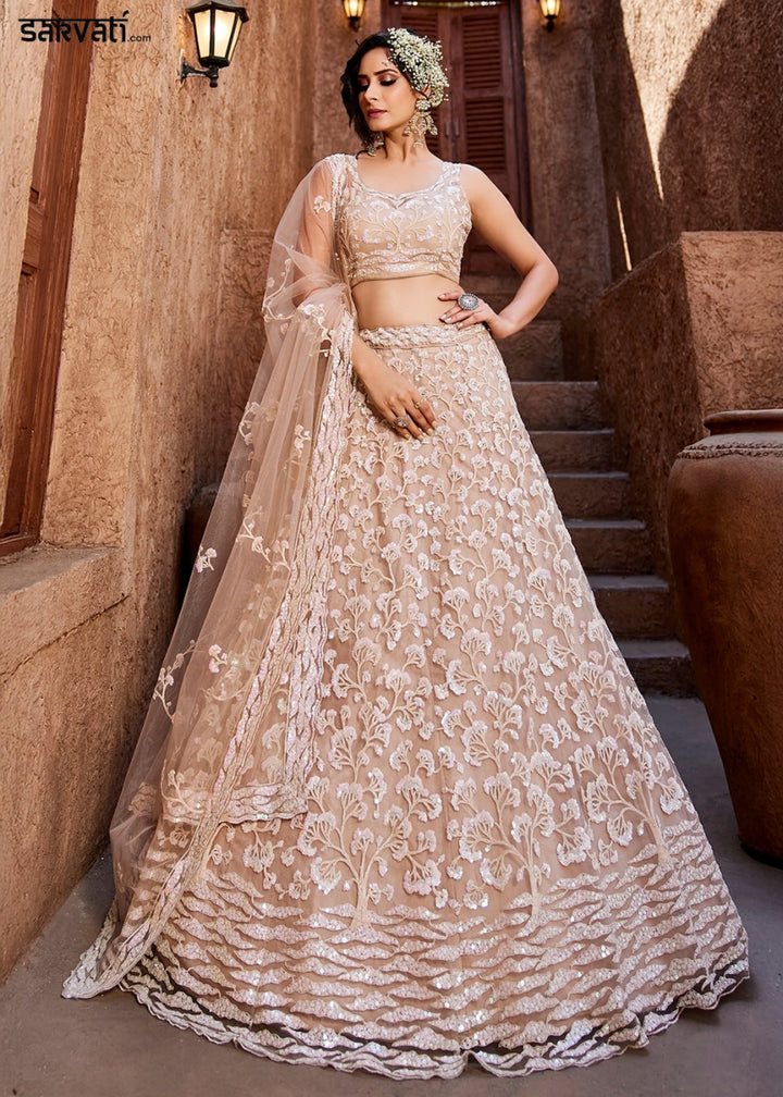 Nude Pink Net Lehenga Choli with Floral Sequin Detailing - House of Sarvati LLC