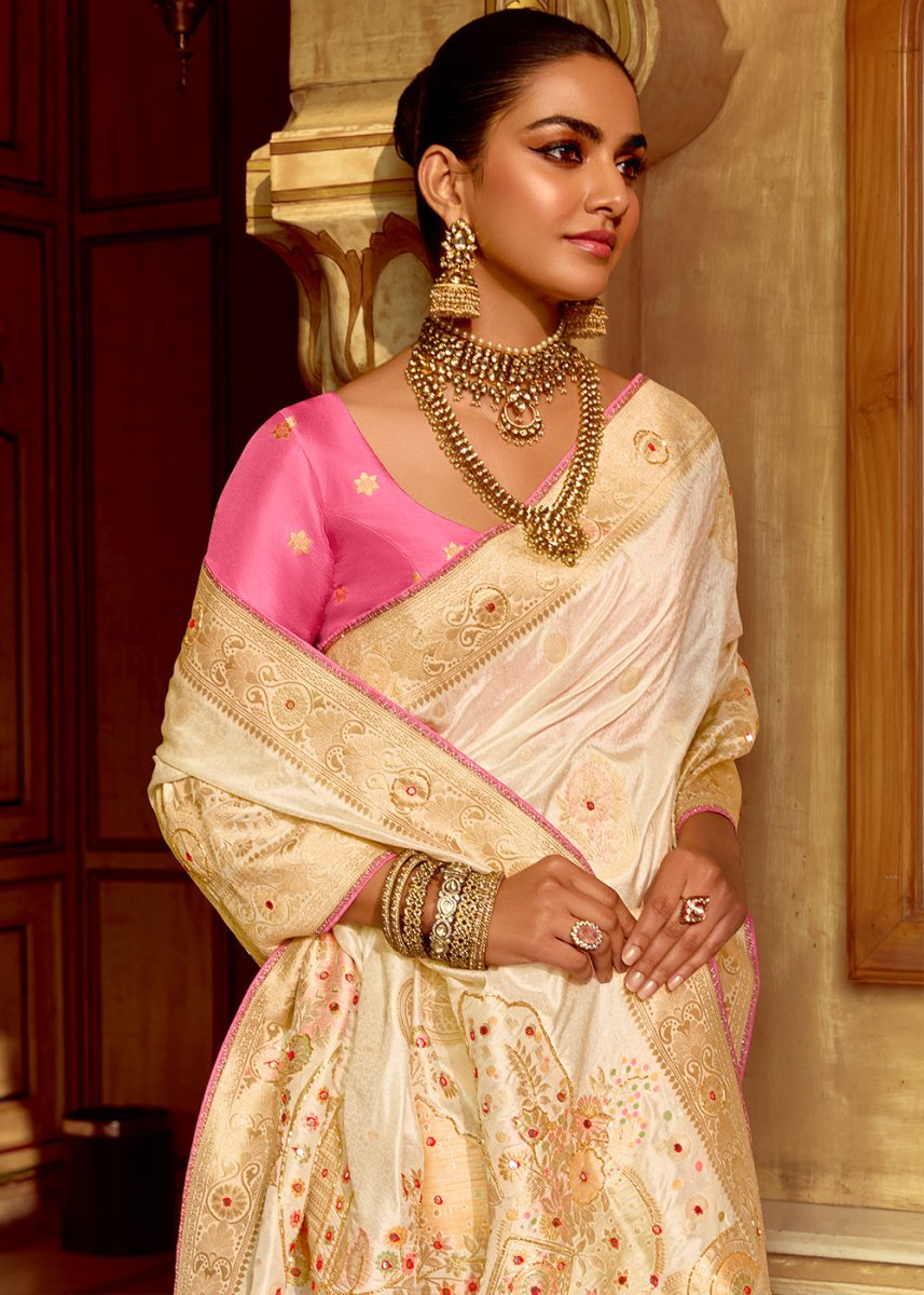 Pearl White Dola Silk Saree Featuring Zari Weave And Intricate Handwork With Cut Dana - House of Sarvati LLC