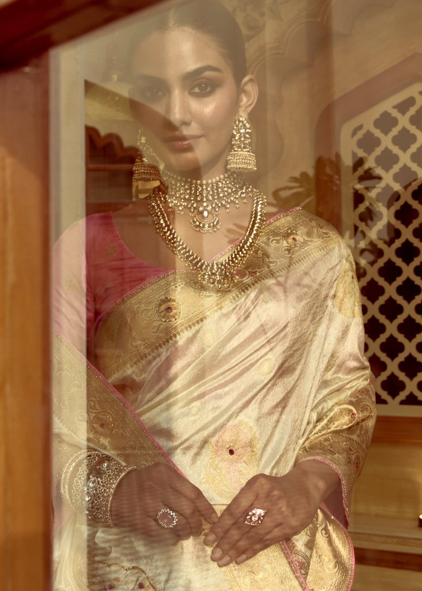 Pearl White Dola Silk Saree Featuring Zari Weave And Intricate Handwork With Cut Dana - House of Sarvati LLC