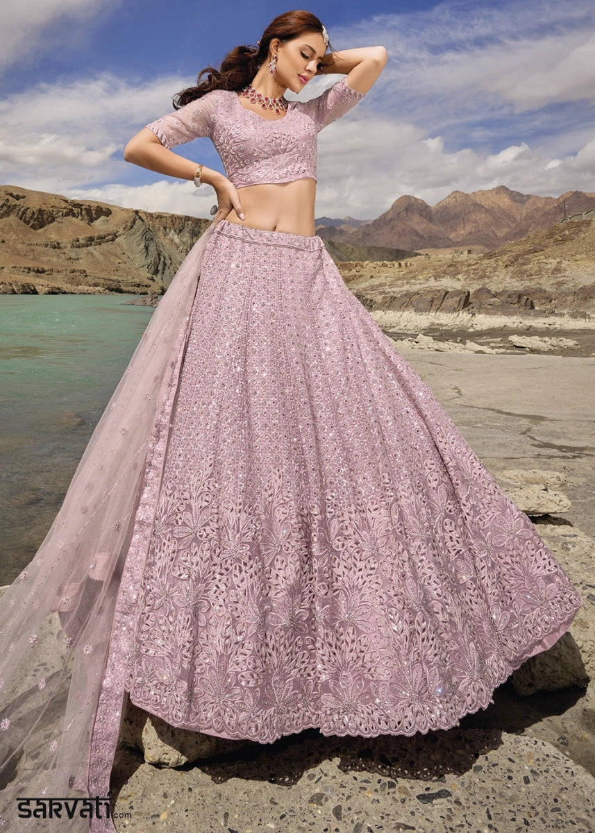 Pinkish Purple Organza Lehenga Choli Adorned With Cutwork, Mirror, And Zarkan Embellishments - House of Sarvati LLC