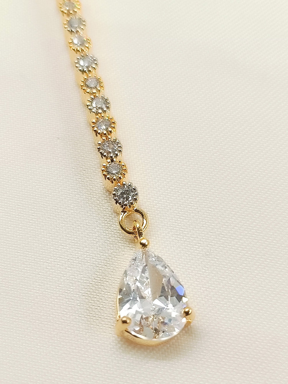 Kaamini White American Diamond Teeka - Gold Plated Brass